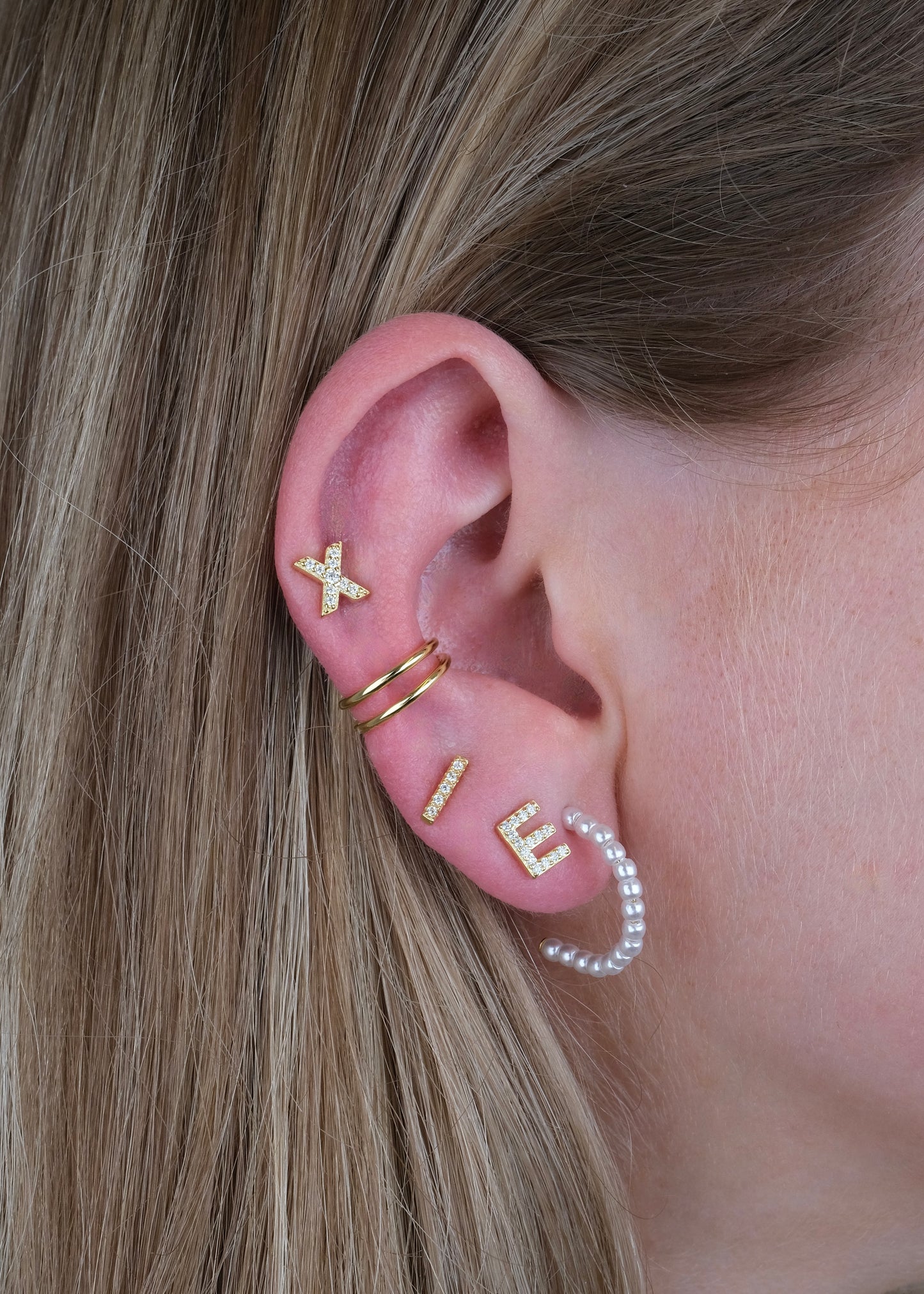 Clous d'oreilles en forme de rayon en argent et plaqué or