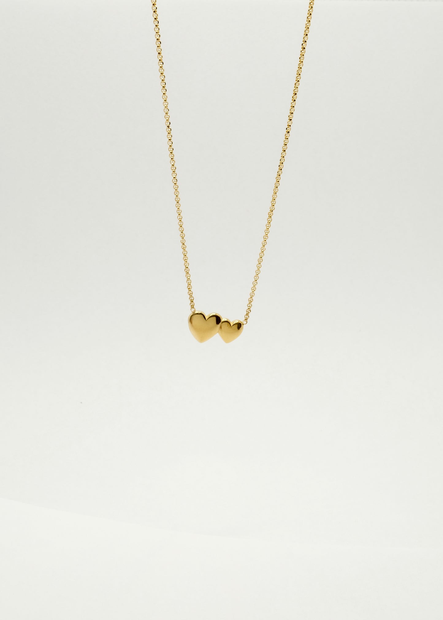 Collier double cœur en argent et plaqué or
