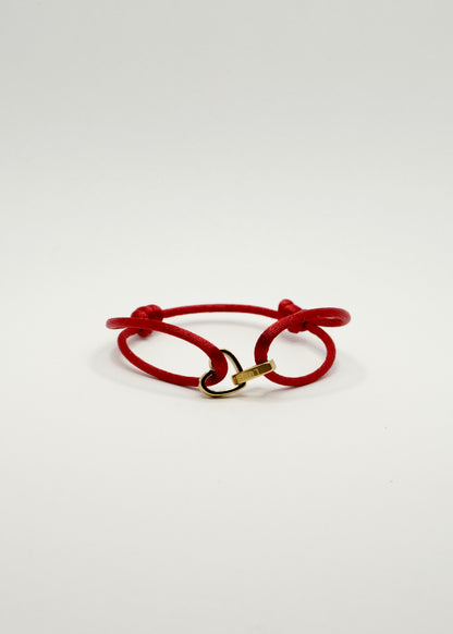 Bracelet sur cordon avec deux anneaux entrelacés en forme de cœur