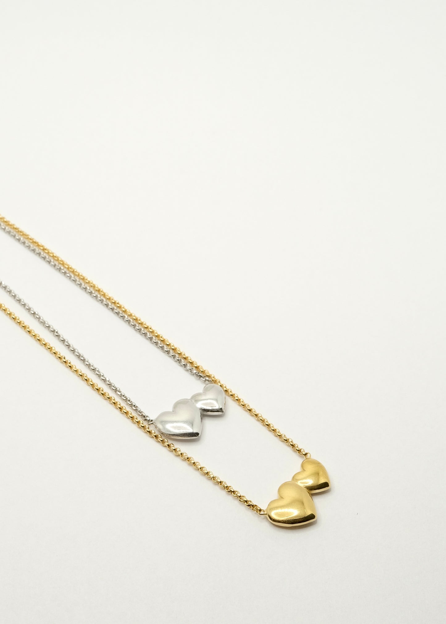 Double heart necklace in silver and gold plated