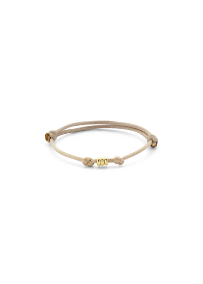 Bracelet sur cordon trois anneaux en or